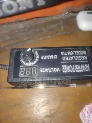 Class D amplifier with two tower speakers and 24V adapter