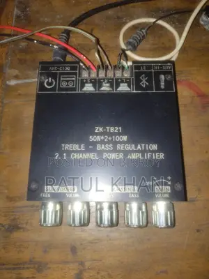 Class D amplifier with two tower speakers and 24V adapter