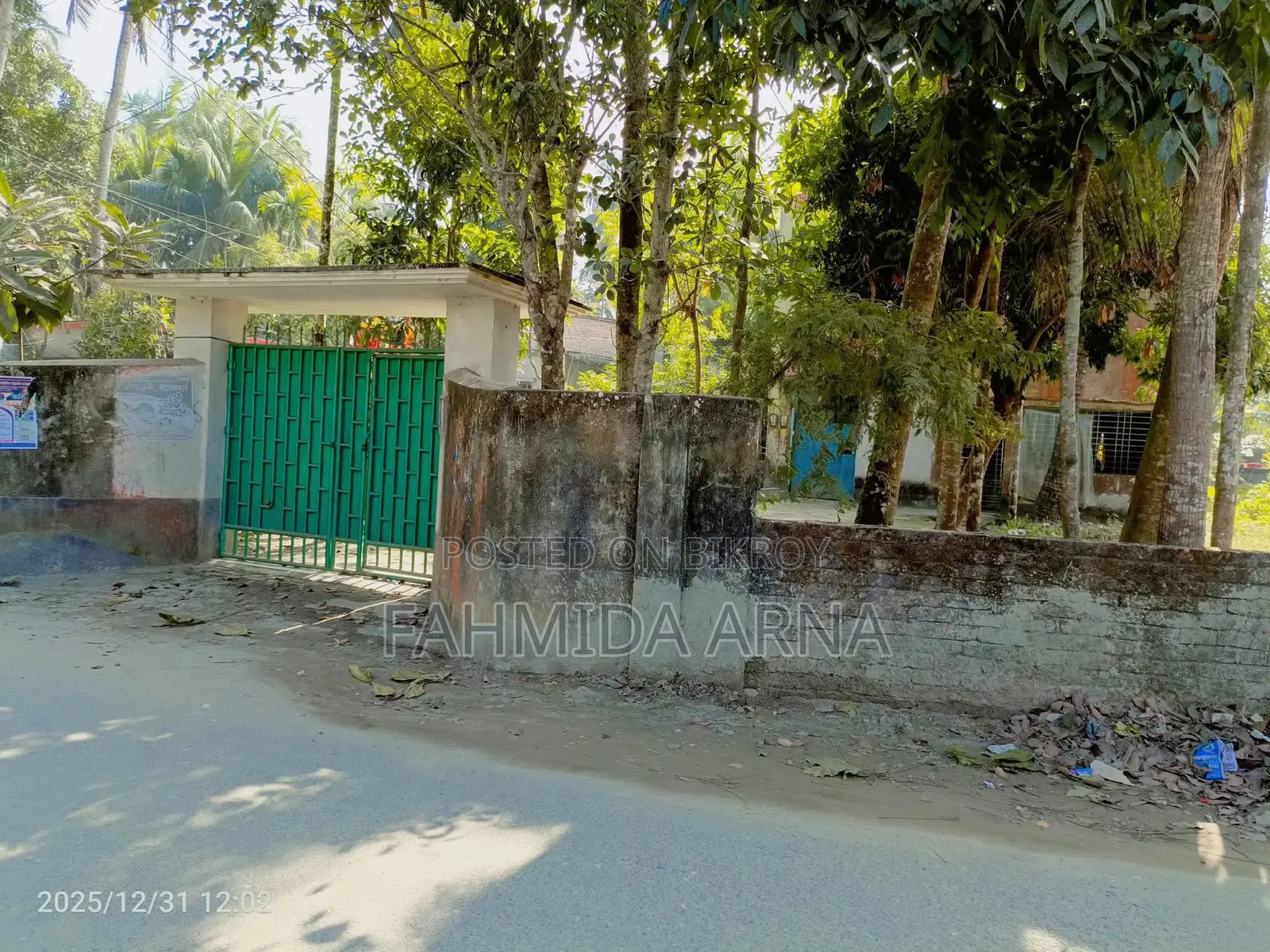 Two-story house with land for sale.