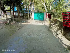 Two-story house with land for sale.
