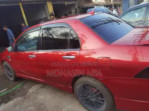 Mitsubishi Lancer . 2004