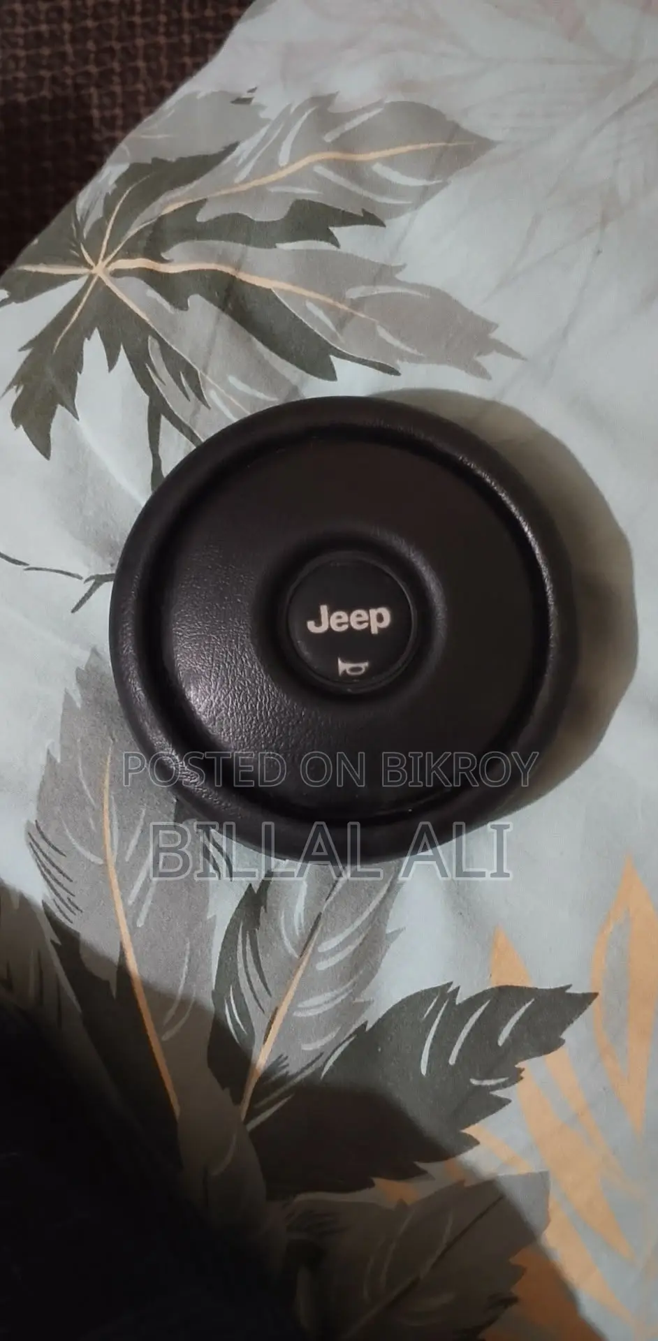 Jeep horn button cap.