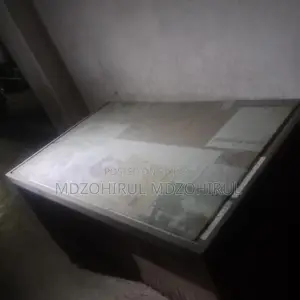 Two hardboard tables, one hardboard wardrobe, and a steel one
