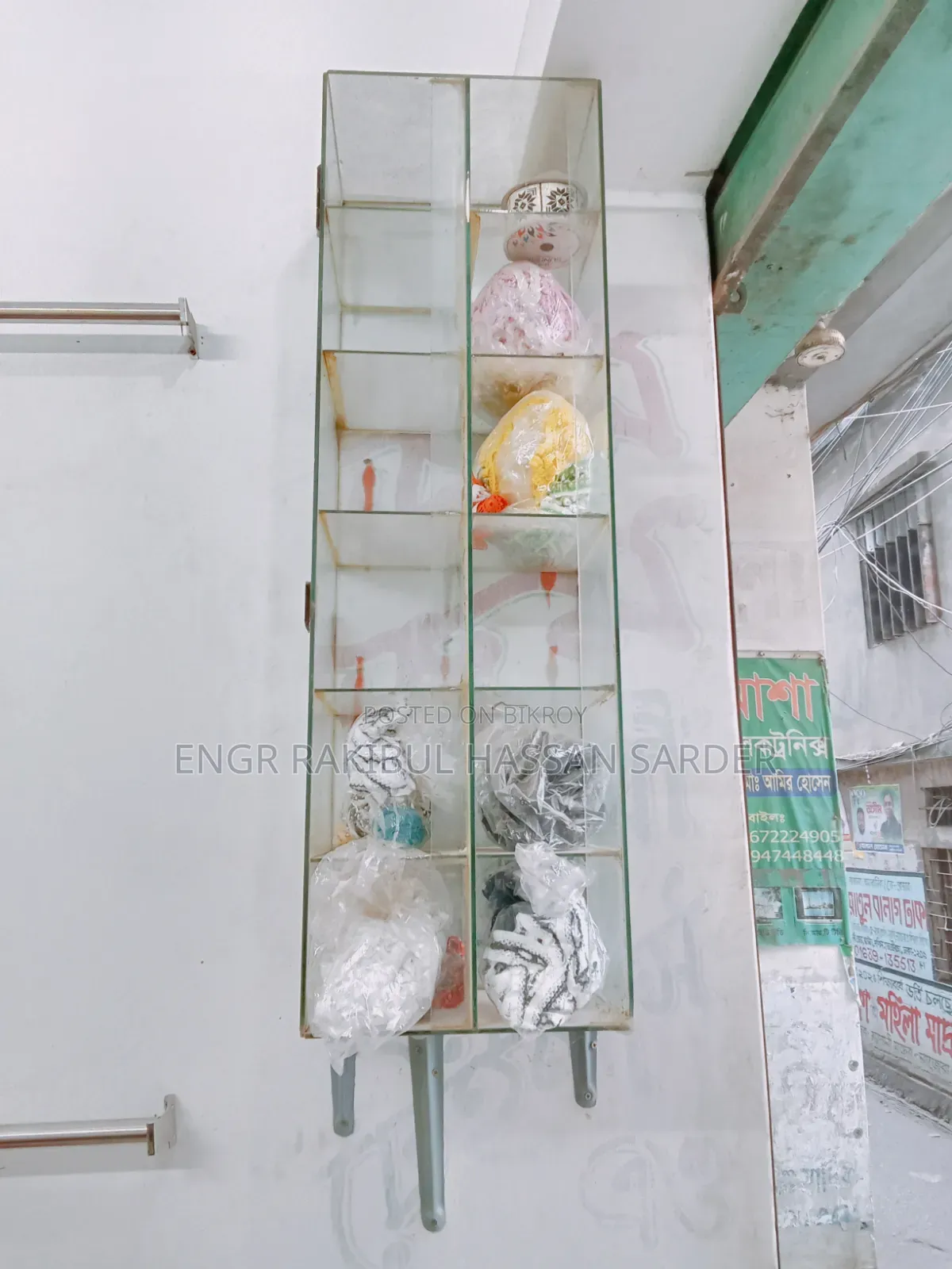 Two glass racks for sale, price 5000/=. One is 1ft × 40 inches, the other is 2×1.