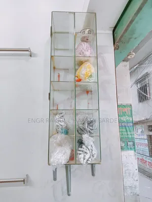 Two glass racks for sale, price 5000/=. One is 1ft × 40 inches, the other is 2×1.