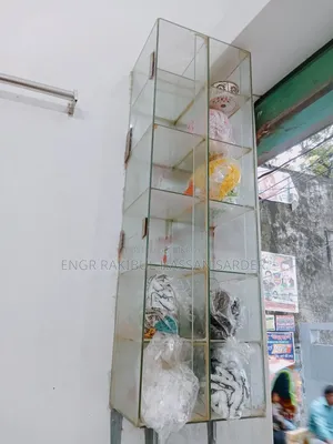 Two glass racks for sale, price 5000/=. One is 1ft × 40 inches, the other is 2×1.