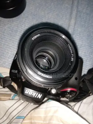 Nikon d5100. with 50 mm. prime lens 2 ta