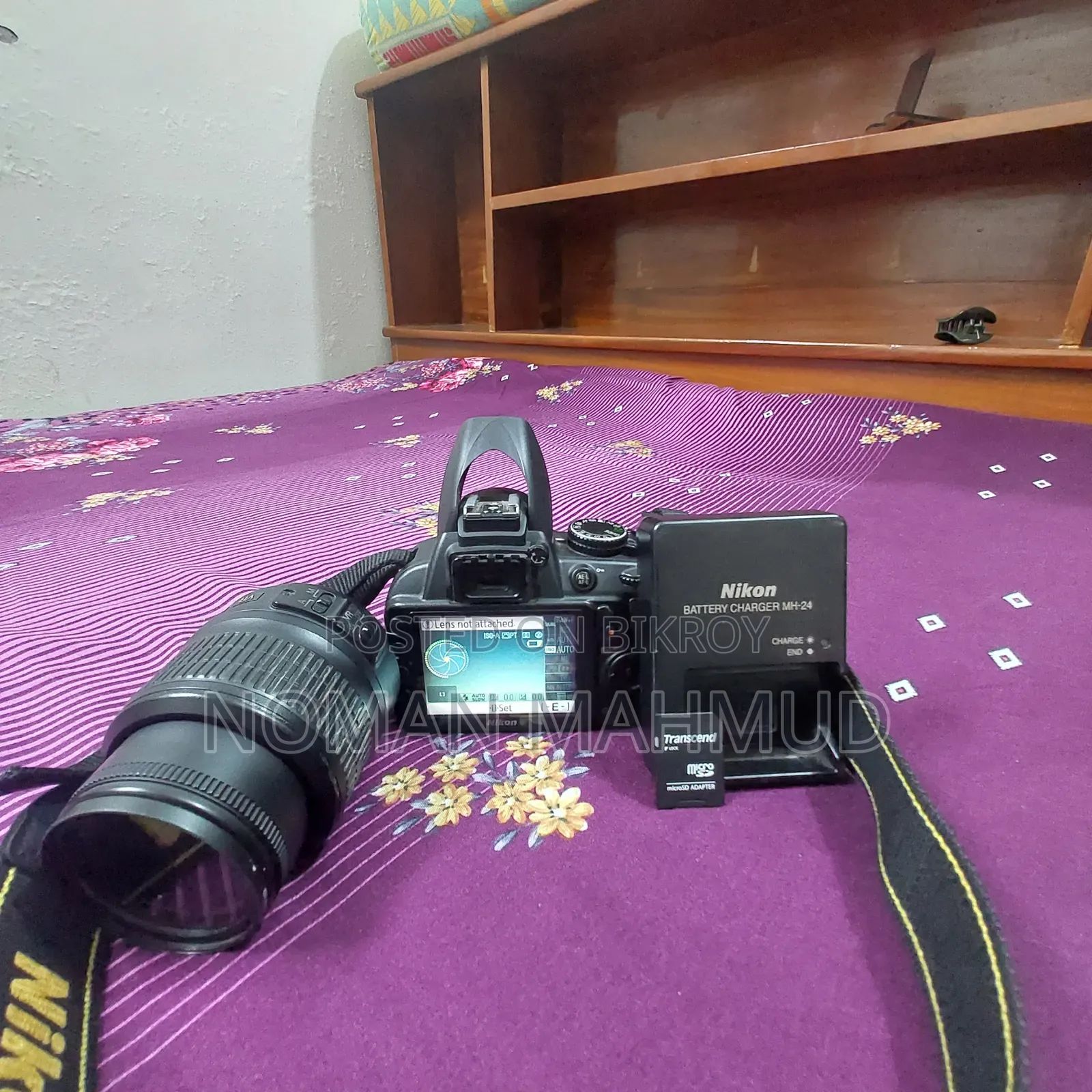 Camera with charger, lens, and free memory card