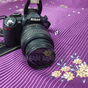 Camera with charger, lens, and free memory card