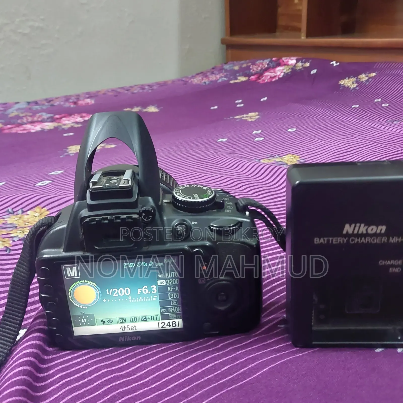 Camera with charger, lens, and free memory card