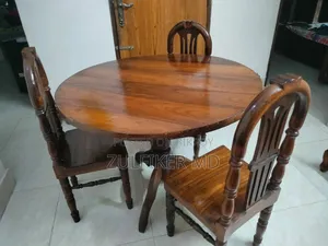 Dining table and three chairs for sale.