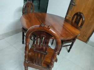 Dining table and three chairs for sale.