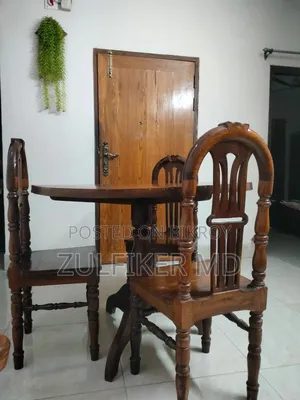 Dining table and three chairs for sale.