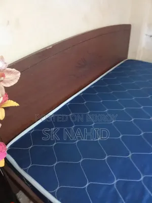 A Bed and a Dressing Table