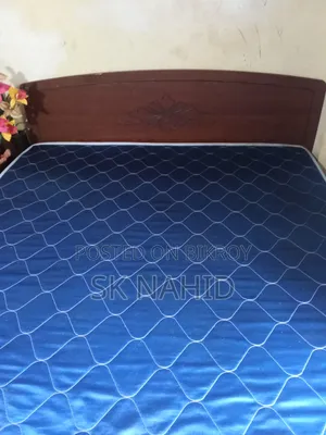 A Bed and a Dressing Table