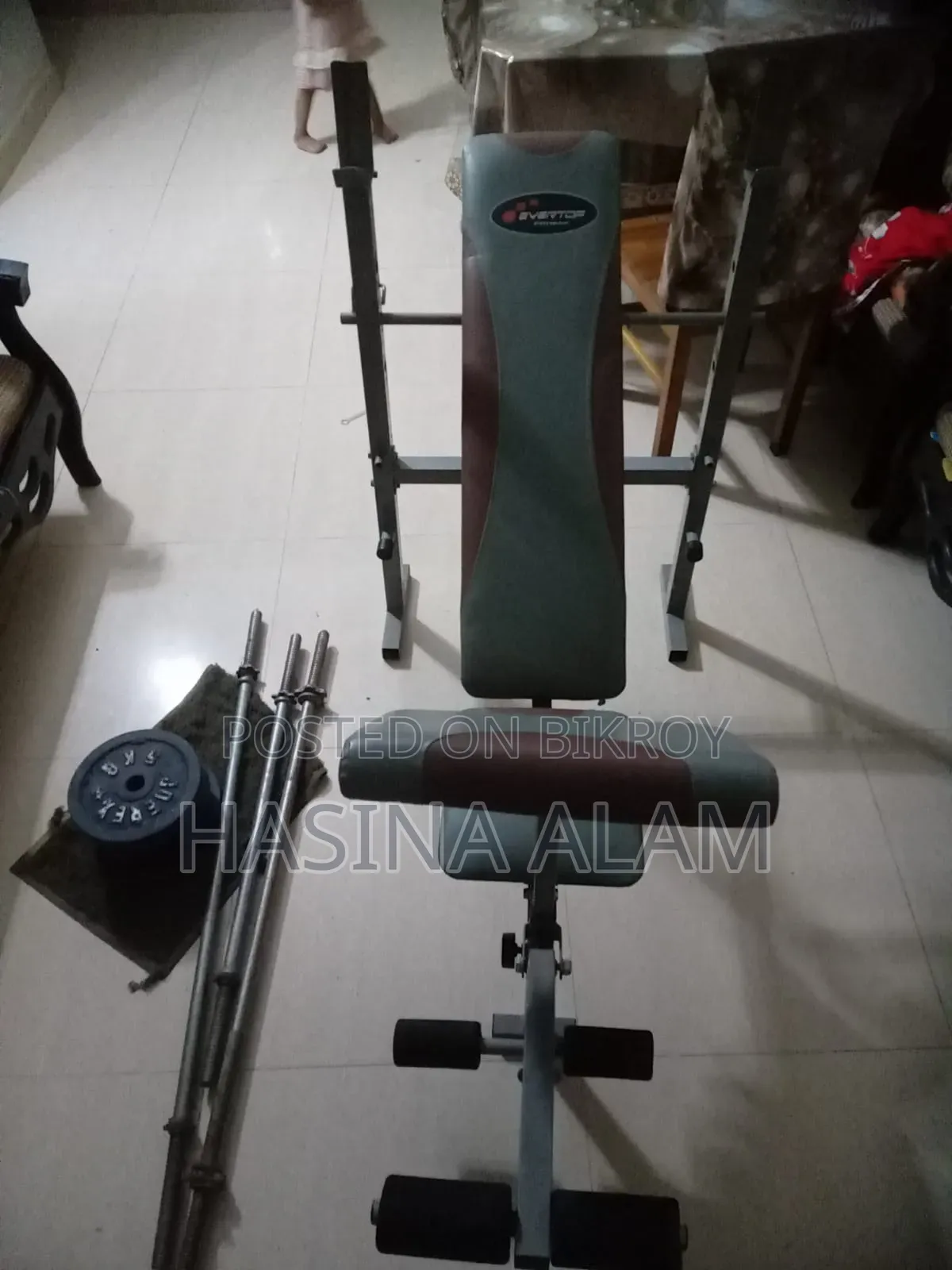 Gym equipment for chest, shoulder, leg, and arm exercises.
