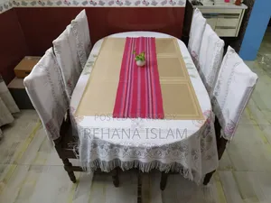 6-seater Teak Wood Dining Table. Comes with a free table cover set.