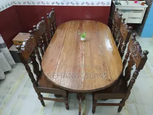 6-seater Teak Wood Dining Table. Comes with a free table cover set.