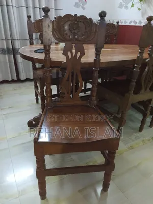 6-seater Teak Wood Dining Table. Comes with a free table cover set.