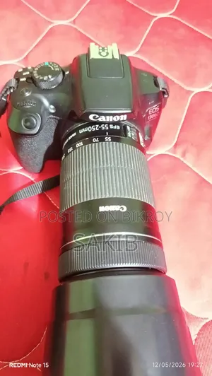 Canon Eos 1300d DSLR Camera Body Paired With a Canon Ef-S55–250mm Zoom