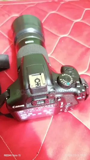 Canon Eos 1300d DSLR Camera Body Paired With a Canon Ef-S55–250mm Zoom