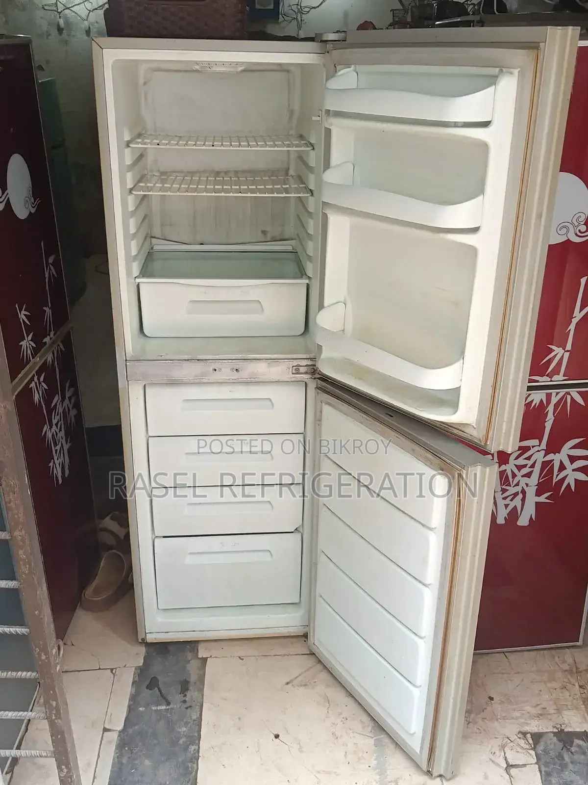 Red colored 14 CFT deep fridge for sale.