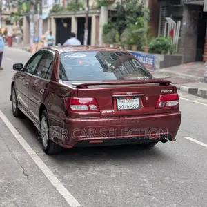 টয়োটা করিনা ১.৫ এফডব্লিউডি সেডান ২০০০ লাল