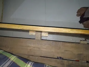 Carved Seven-Foot Wooden Bed