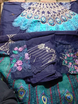 Pakistani Unstitched Three-Piece. Available at Wholesale Price.