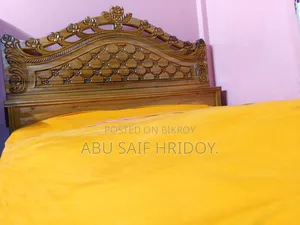 Akash Moni wood bed for sale.