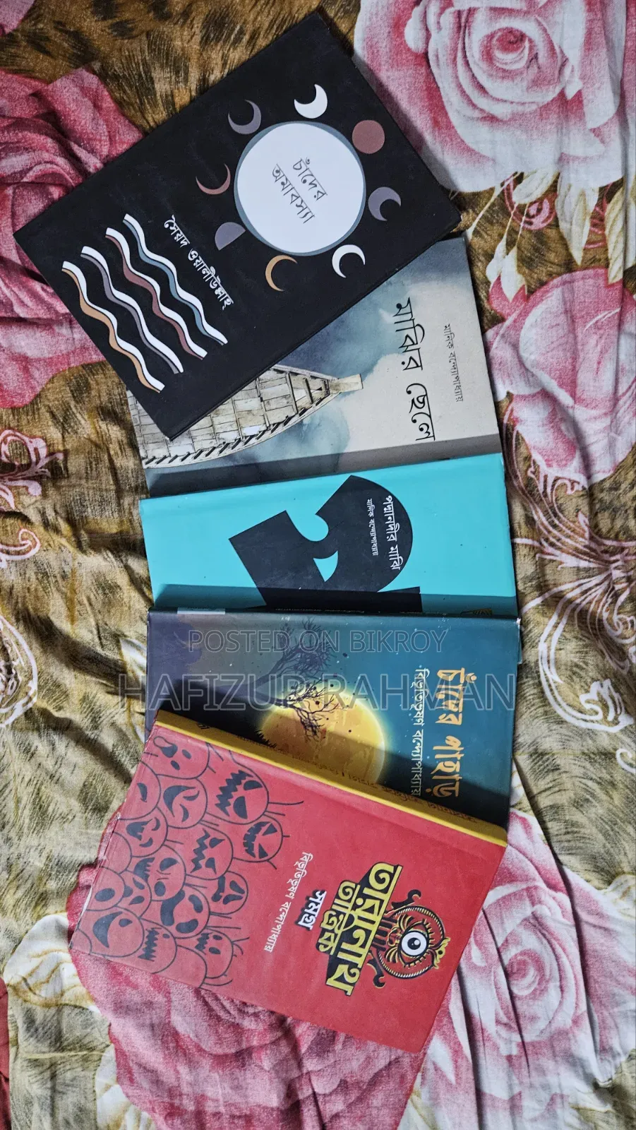 Five books bought from the book fair, now selling them