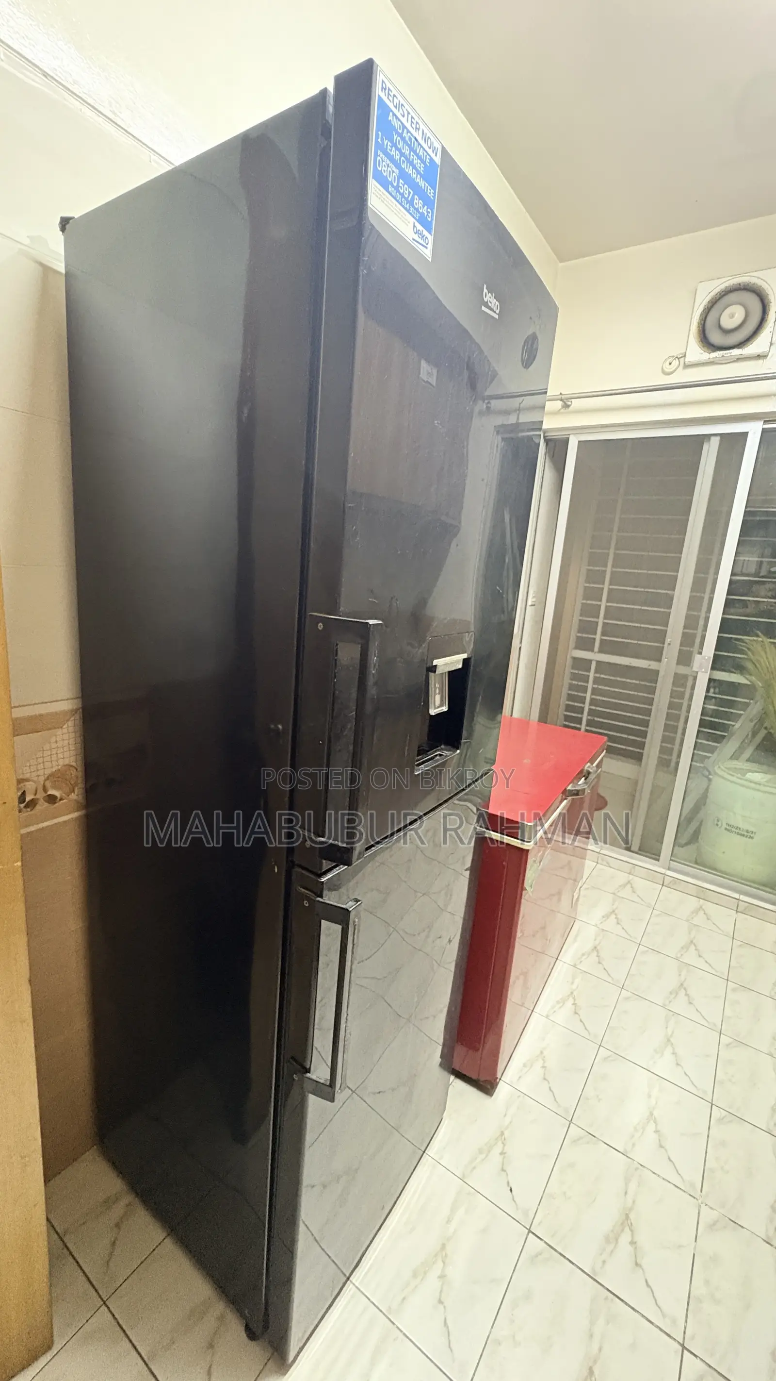 Tall Black Beko Fridge With Dispenser