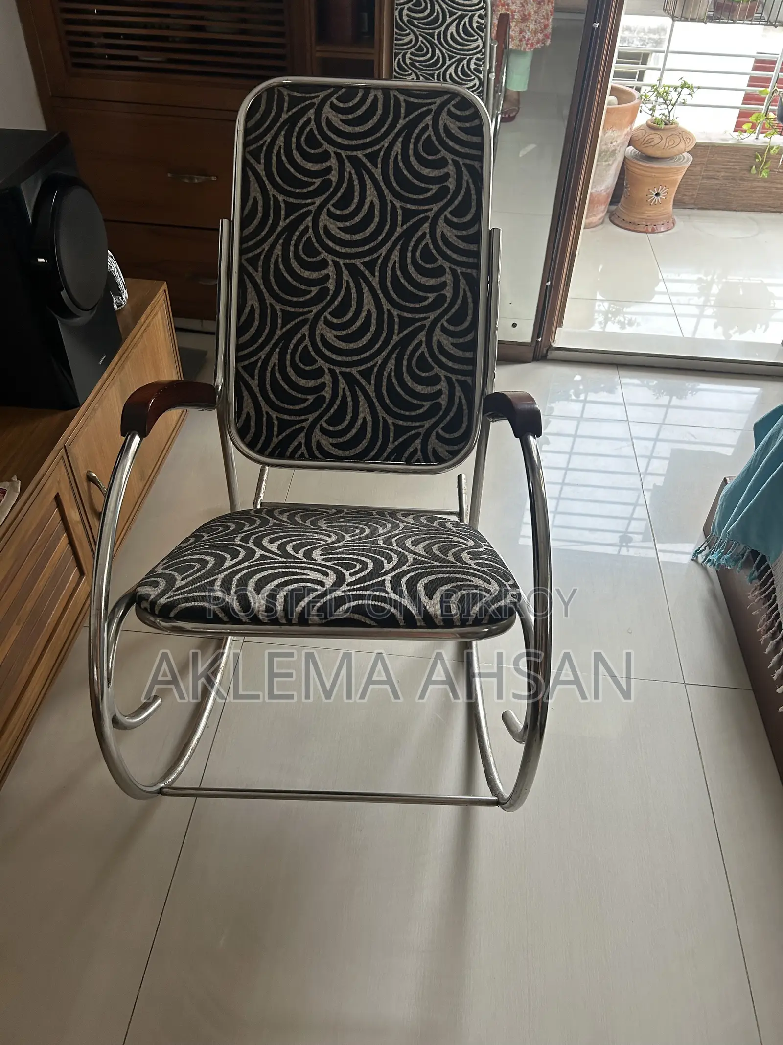 Revolving Chair, black fabric, steel armrests, and steel base