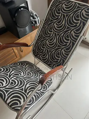 Revolving Chair, black fabric, steel armrests, and steel base