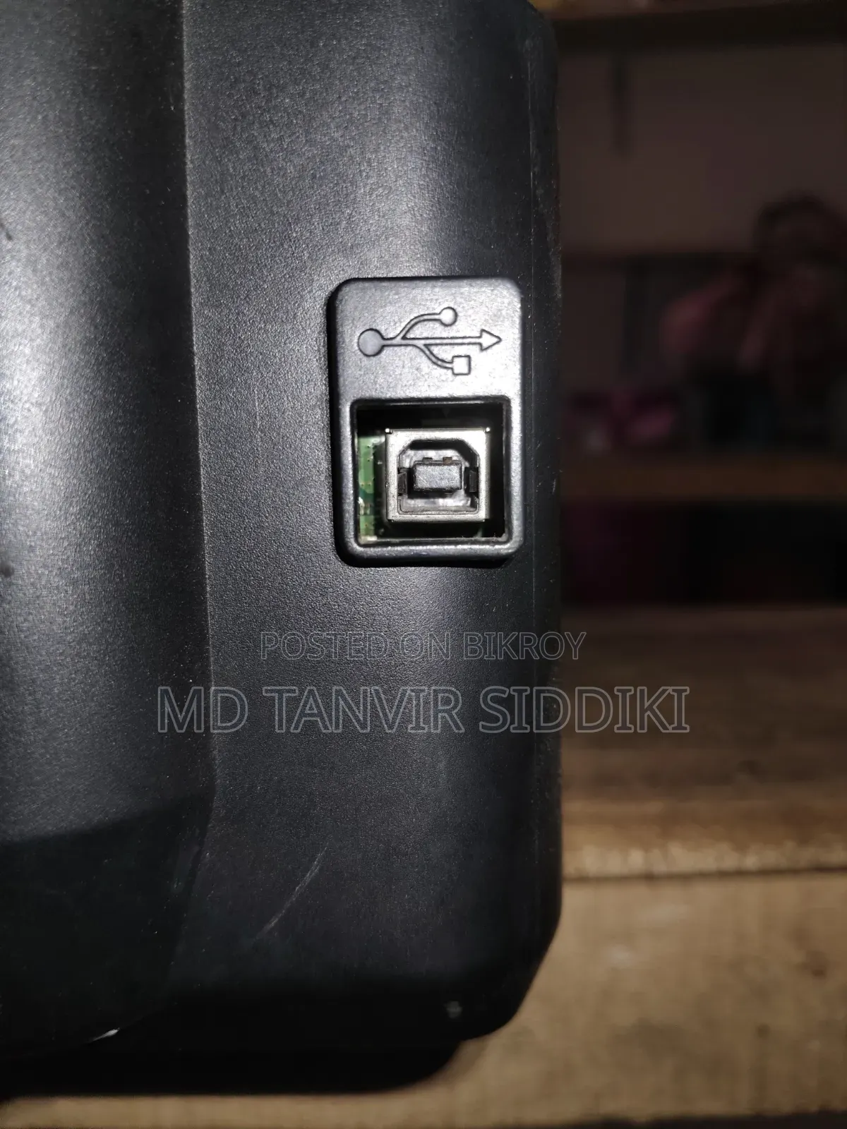 This printer turns on but the output cable is missing.