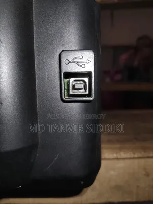 This printer turns on but the output cable is missing.