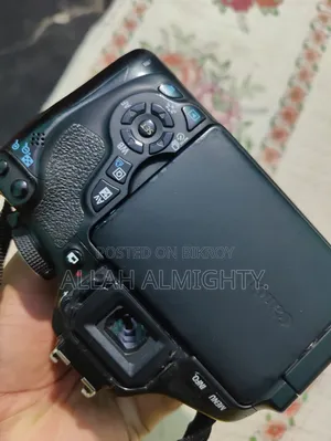 Canon 600D with 55-250 Zoom Lens (Minor display shadow, no issues)