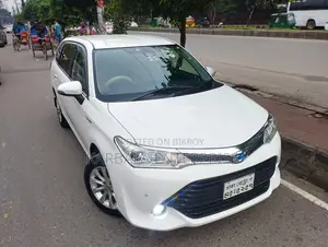 টয়োটা করোলা ফিল্ডার ১.৫ হাইব্রিড এফডব্লিউডি ২০১৫ হোয়াইট