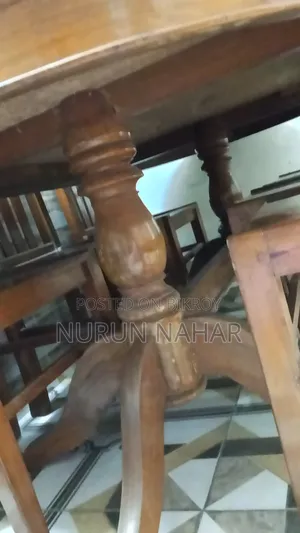 Dining Table. Six Chairs. Made of Teak Wood.