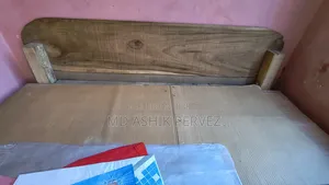 4/6.5 ft sturdy wooden bed frame with mattress for sale.