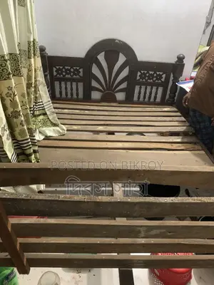 A used solid teak wood log for sale