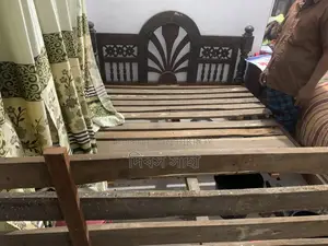A used solid teak wood log for sale