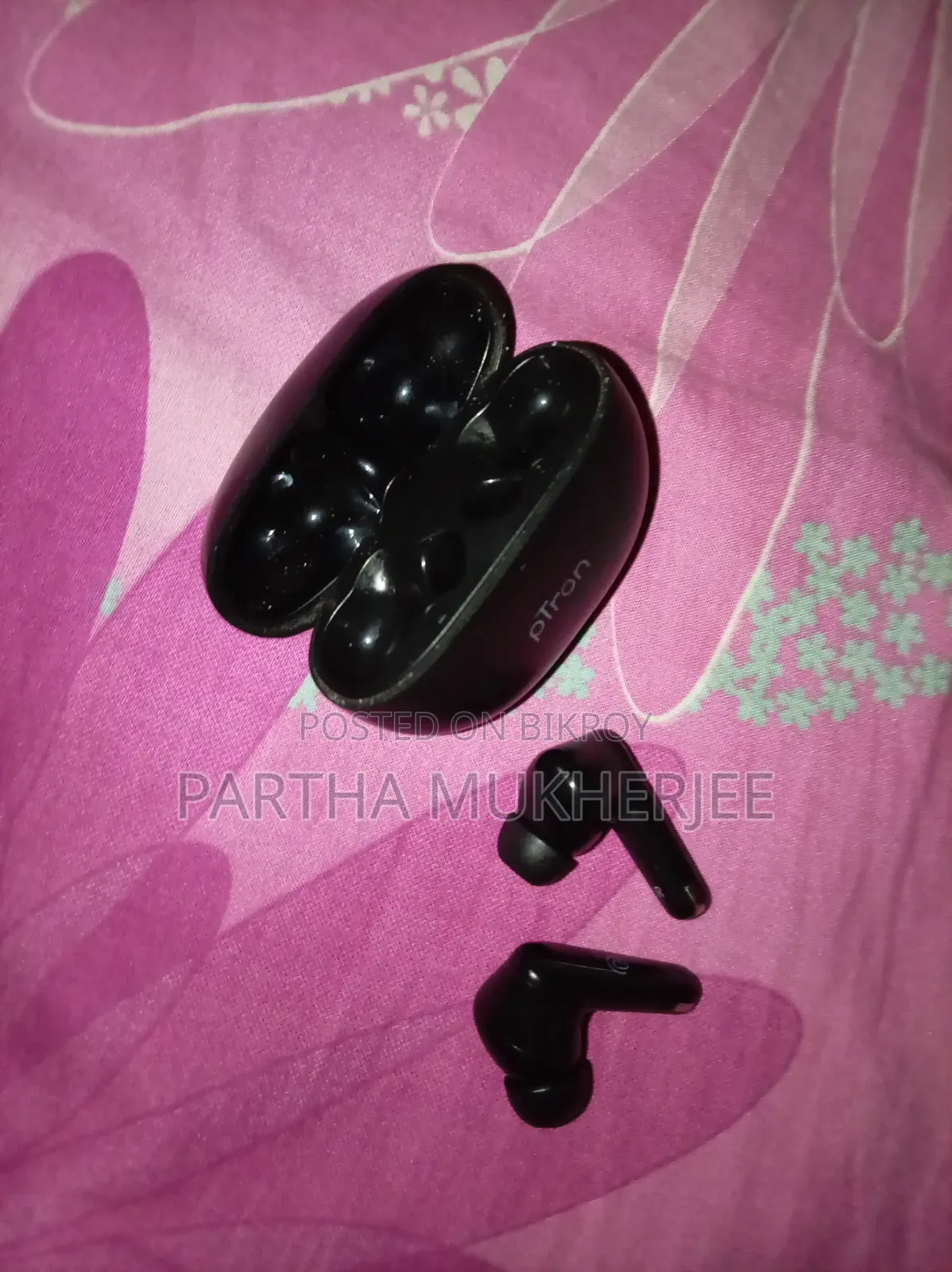 Used Ptron Wireless Earbuds.