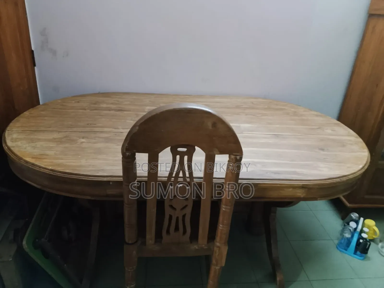 Large wooden dining table and 5 wooden chairs
