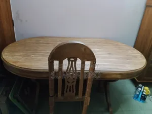 Large wooden dining table and 5 wooden chairs
