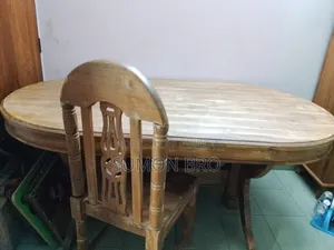 Large wooden dining table and 5 wooden chairs