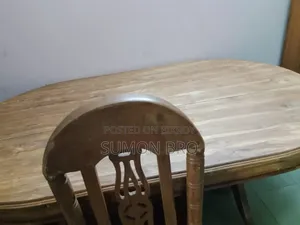 Large wooden dining table and 5 wooden chairs