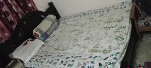 Old but large size wooden bed for sale.