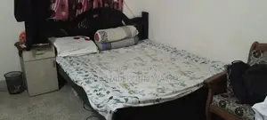 Old but large size wooden bed for sale.