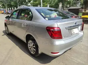টয়োটা এক্সিও ১.৫ হাইব্রিড জি টু হুইল ড্রাইভ ২০১৫ সিলভার